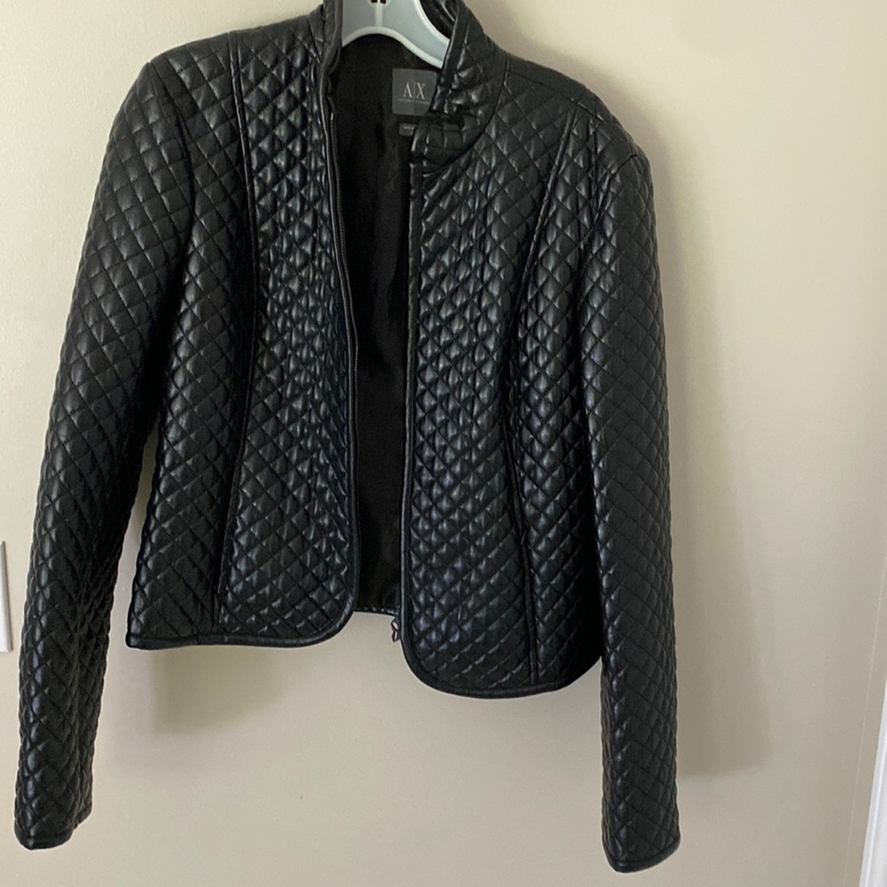 Women Armani puff jacket 100% polyurethane outer, lining 100% polyester.